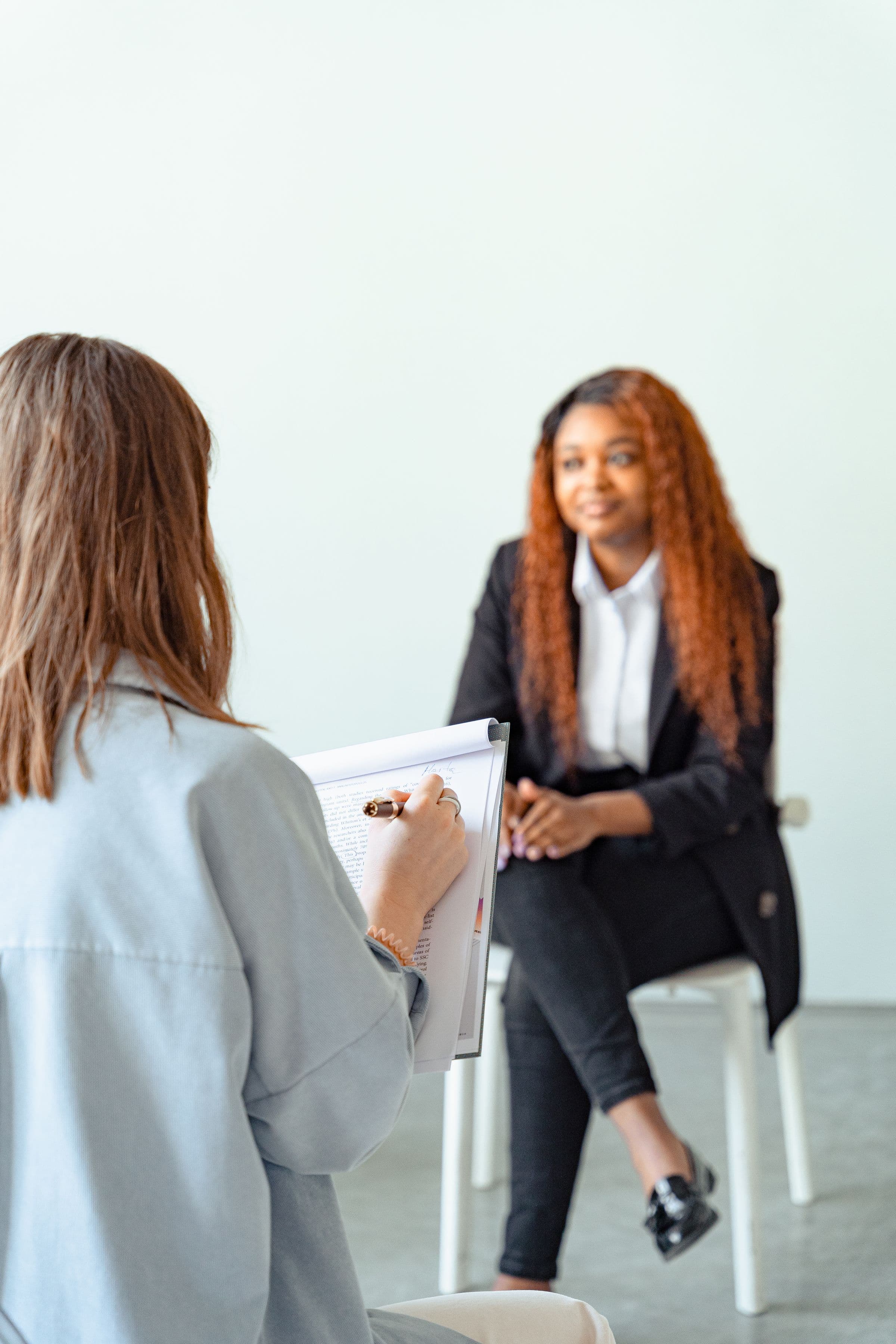 Two people in a quiet one-to-one consultation.