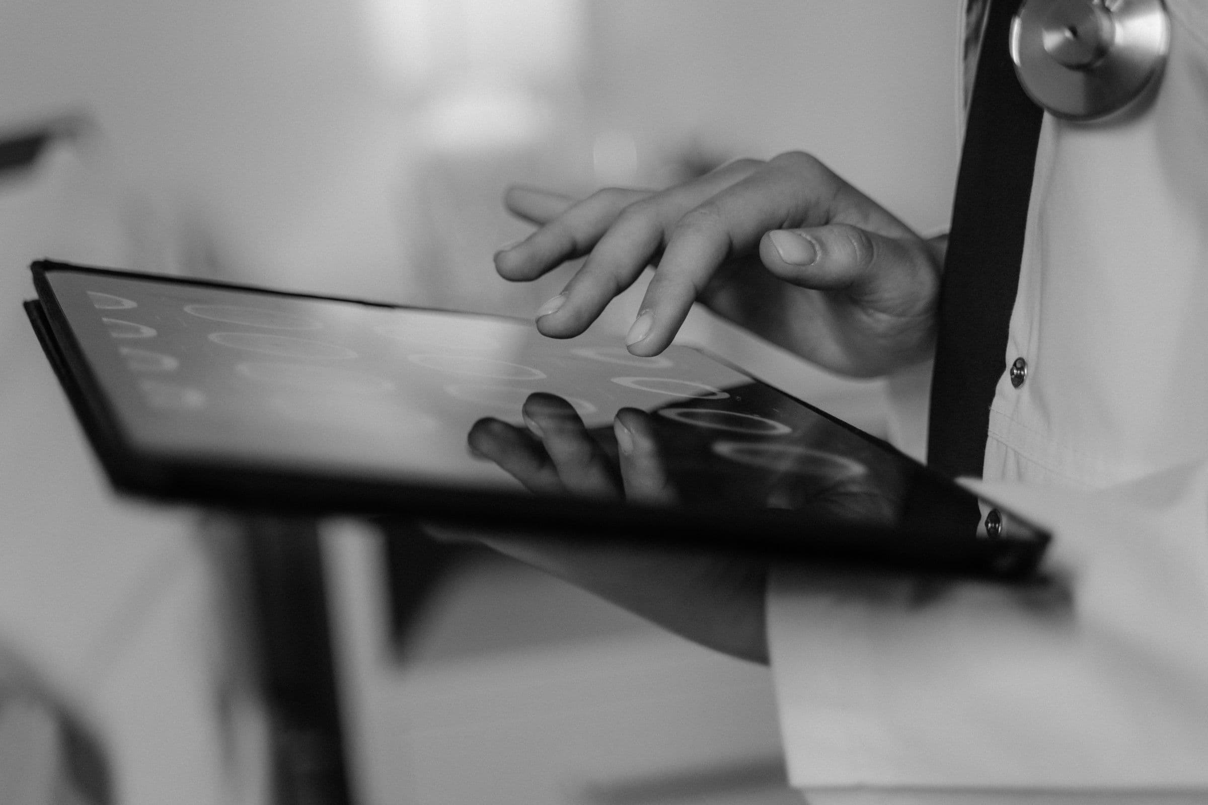 Clinical systems and screens in a healthcare technology workspace.