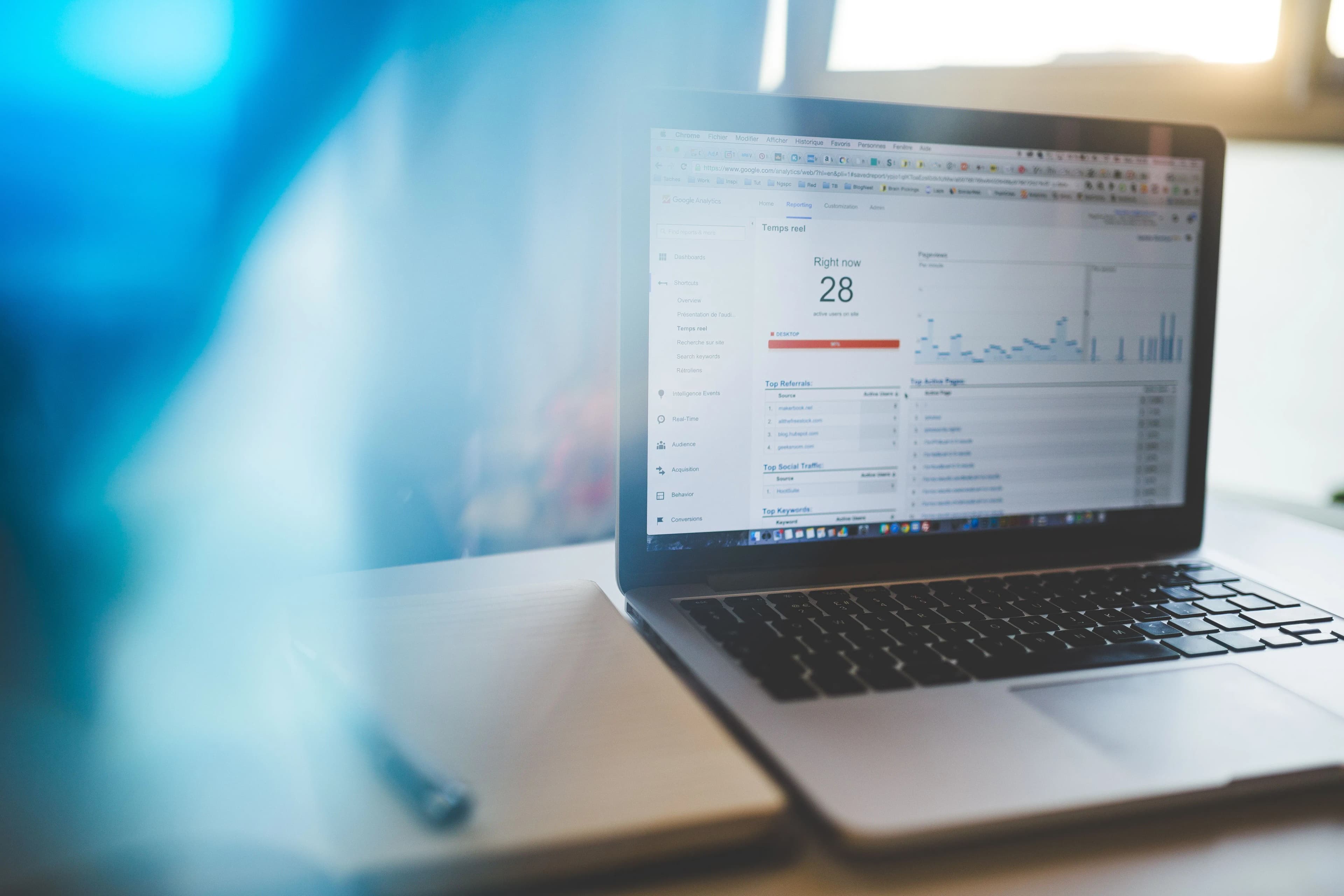 Laptop showing a live analytics dashboard during a digital marketing review.