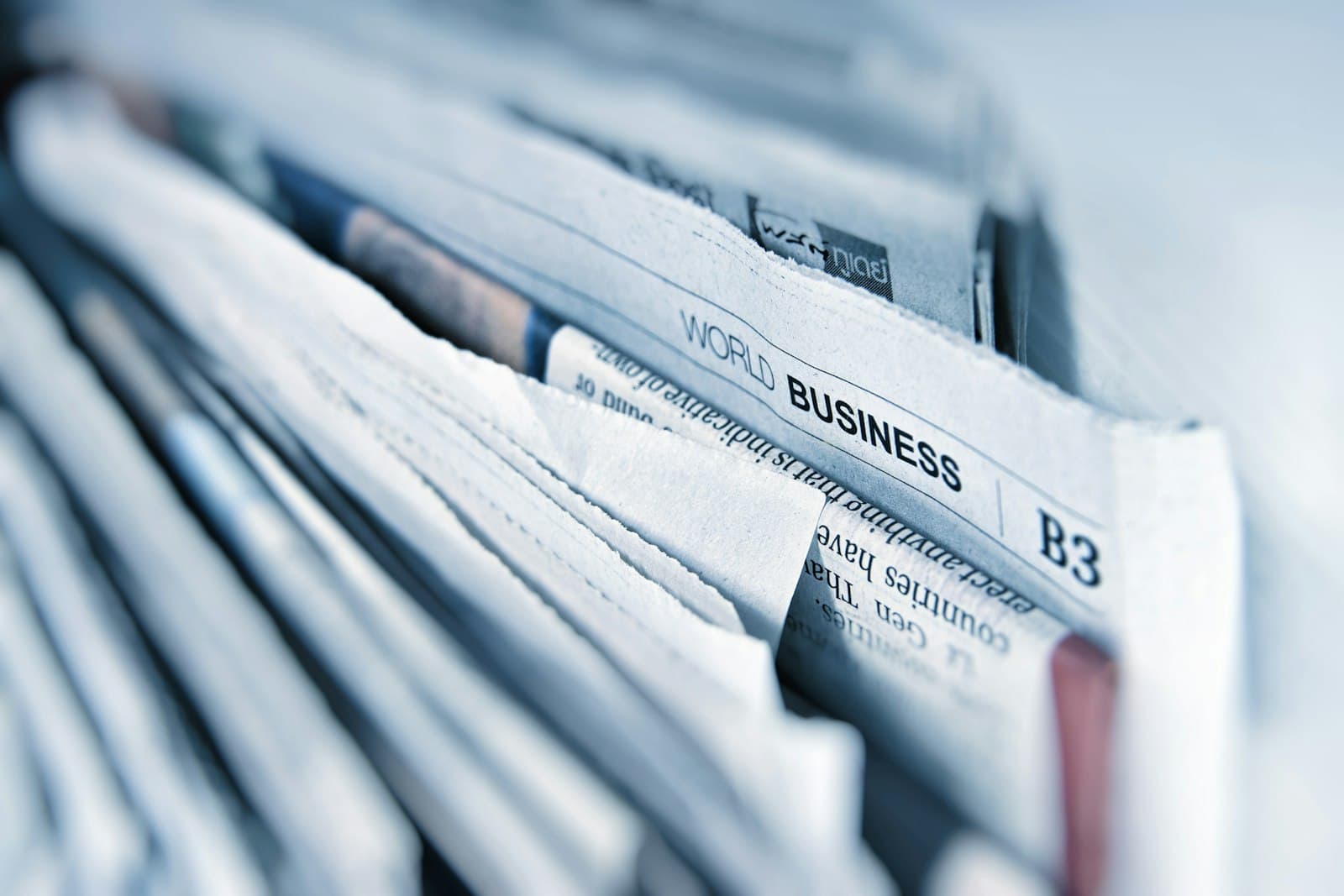 A stack of folded newspapers ready for print advertising.