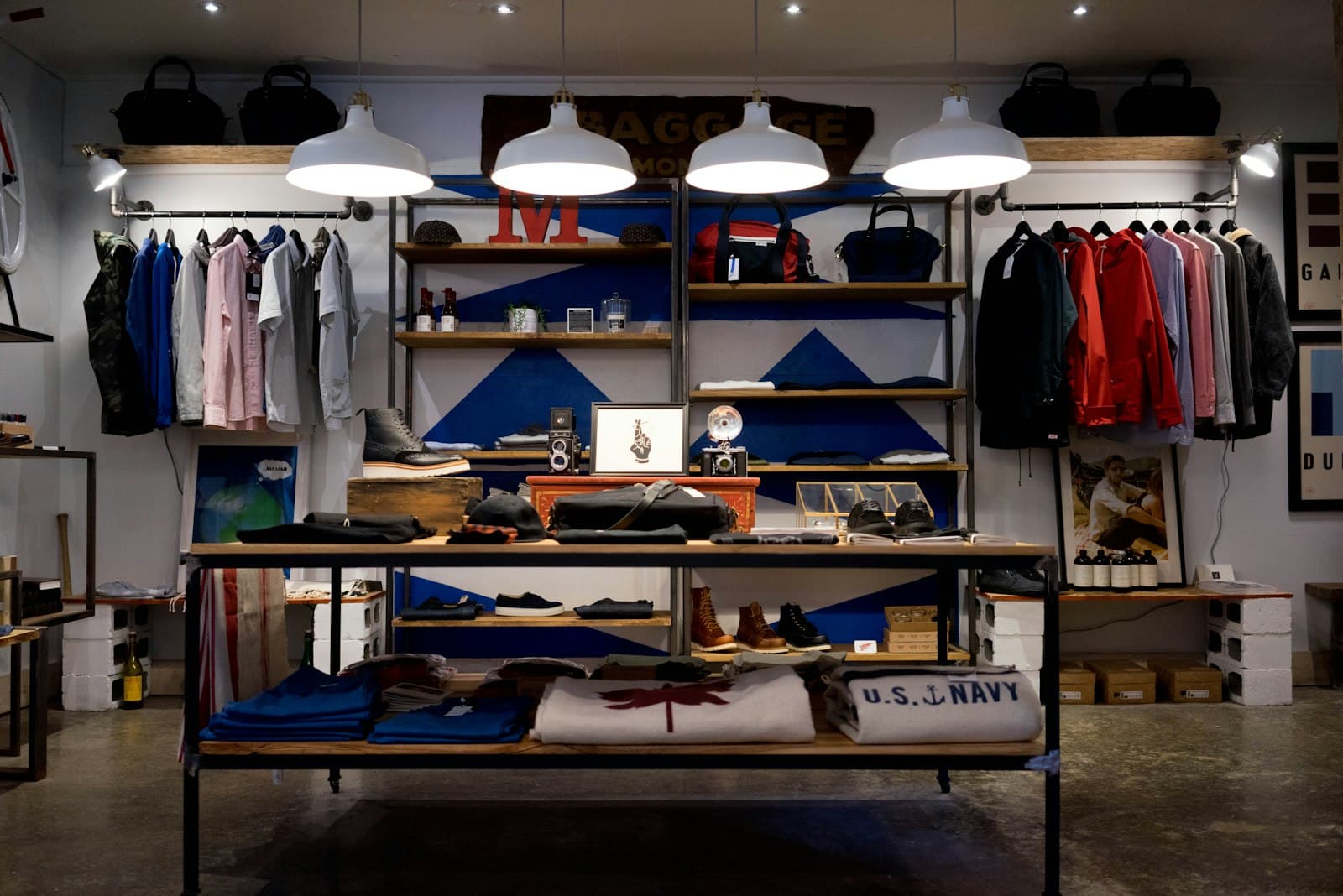 A retail shop floor with clothing displays, shelves, and branded fixtures.