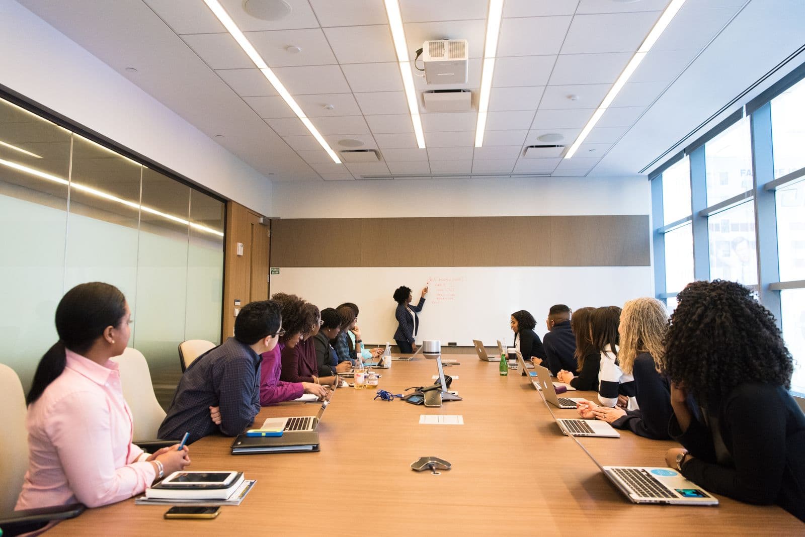A team briefing in a meeting room.
